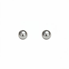 A pair of Ball Stud Earrings 4mm by Skōsh Jewelry, featuring smooth, highly polished round sterling silver balls on post backs, displayed against a white background.
