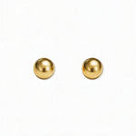 A pair of Ball Stud Earrings 6mm by Skōsh Jewelry, featuring smooth, highly polished round gold balls on post backs, displayed against a white background.