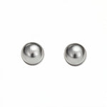 A pair of Ball Stud Earrings 8mm by Skōsh Jewelry, featuring smooth, highly polished round sterling silver balls on post backs, displayed against a white background.