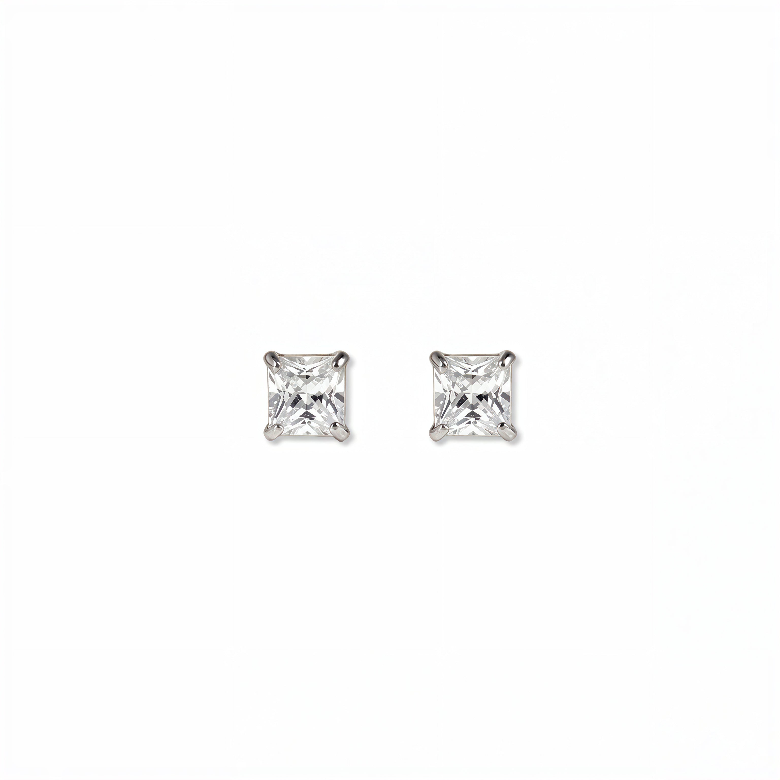 A pair of Princess Cut White Cubic Zirconia Stud Earrings 4mm by Skōsh Jewelry, featuring square princess-cut clear stones in a four-prong sterling silver setting, displayed against a white background.