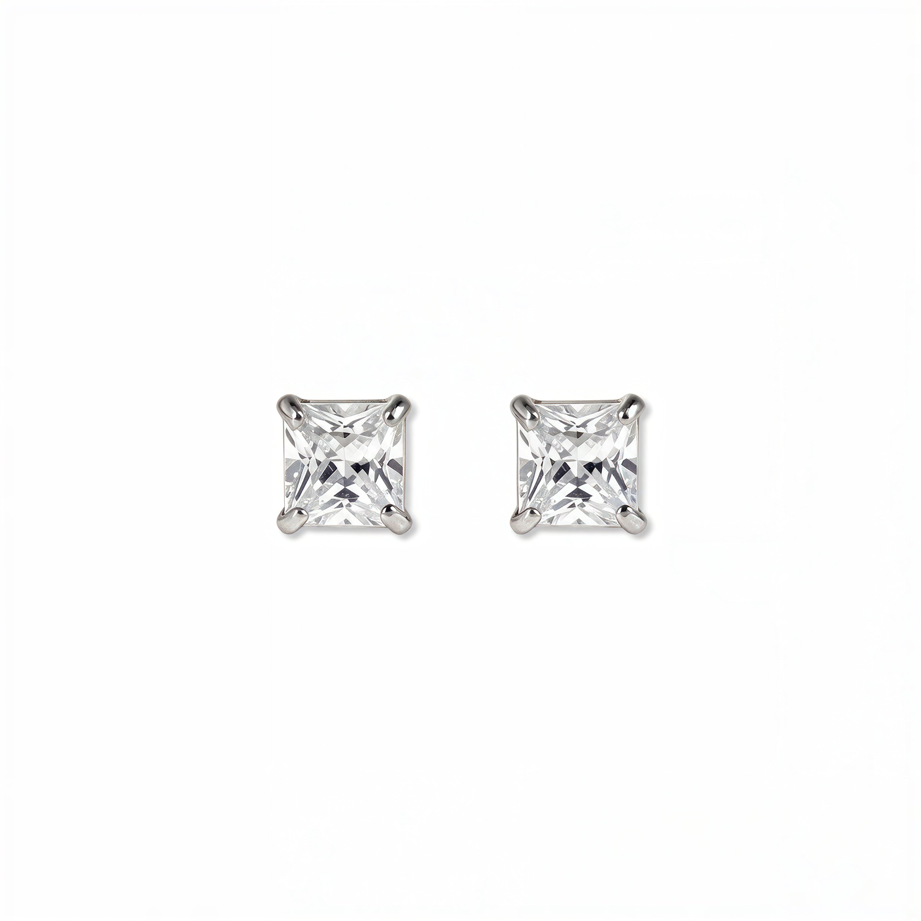 A pair of Princess Cut White Cubic Zirconia Stud Earrings 6mm by Skōsh Jewelry, featuring square princess-cut clear stones in a four-prong sterling silver setting, displayed against a white background.