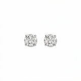 A pair of Round White Cubic Zirconia Stud Earrings 6mm by Skōsh Jewelry, featuring round, faceted clear stones in a four-prong sterling silver setting, displayed against a white background.