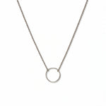 An Infinity Circle Necklace by Skōsh Jewelry, featuring a single open circle pendant attached at both sides to a delicate sterling silver cable chain, displayed against a white background.