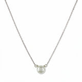 A Skōsh Kids Freshwater Pearl Necklace by Skōsh Jewelry, featuring a single round white freshwater pearl on a fine sterling silver chain, displayed against a white background.