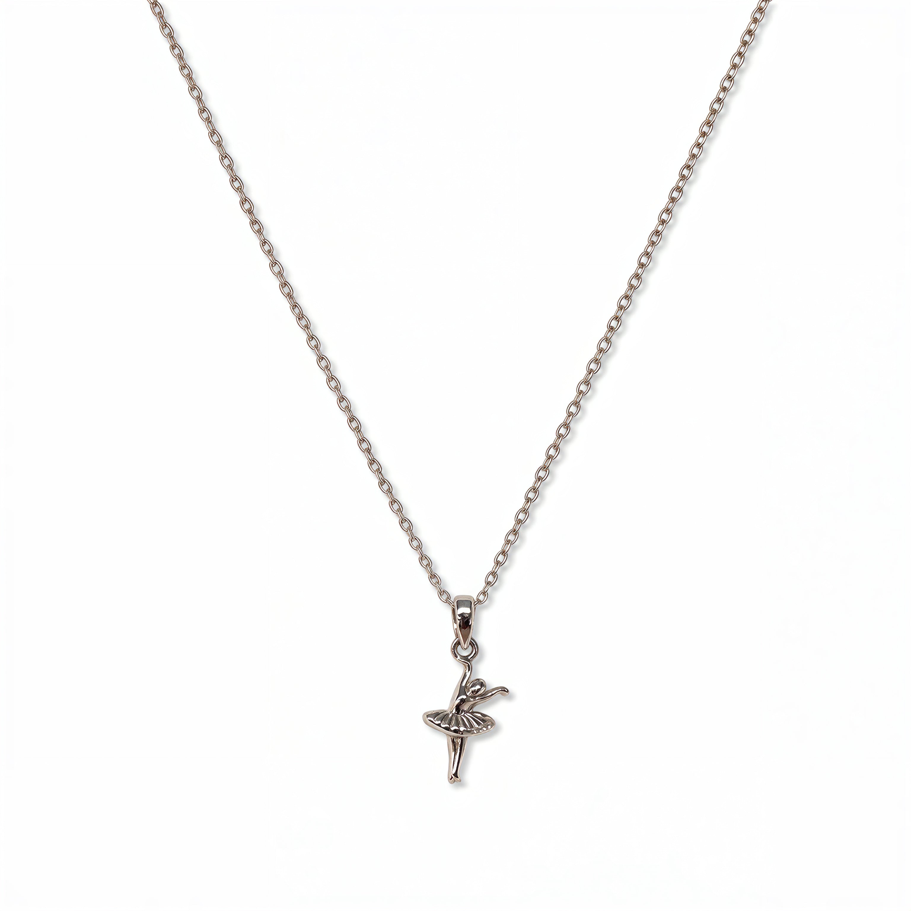 A Skōsh Kids Ballerina Pendant Necklace by Skōsh Jewelry, featuring a small ballerina figure pendant posed mid-dance on a fine sterling silver chain, displayed against a white background.