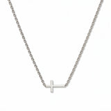 A Skōsh Kids Inline Sideways Cross Necklace by Skōsh Jewelry, featuring a slim polished cross set sideways on a fine sterling silver chain, displayed against a white background.