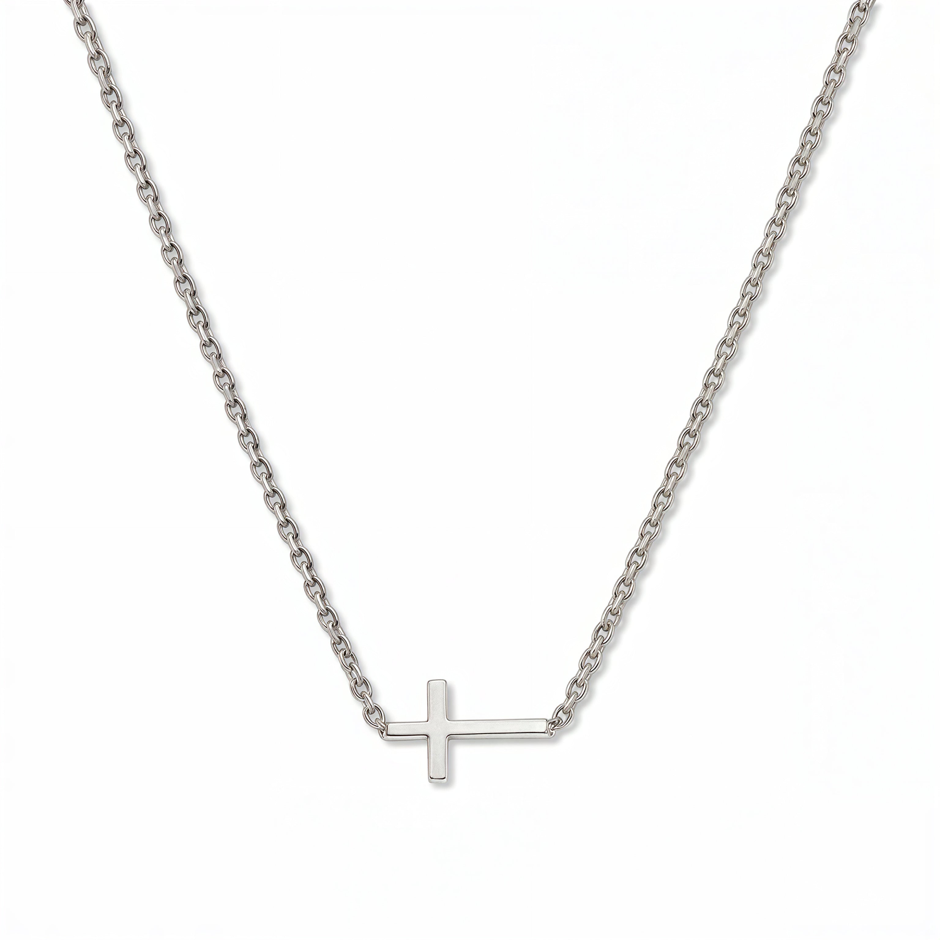 A Skōsh Kids Inline Sideways Cross Necklace by Skōsh Jewelry, featuring a slim polished cross set sideways on a fine sterling silver chain, displayed against a white background.