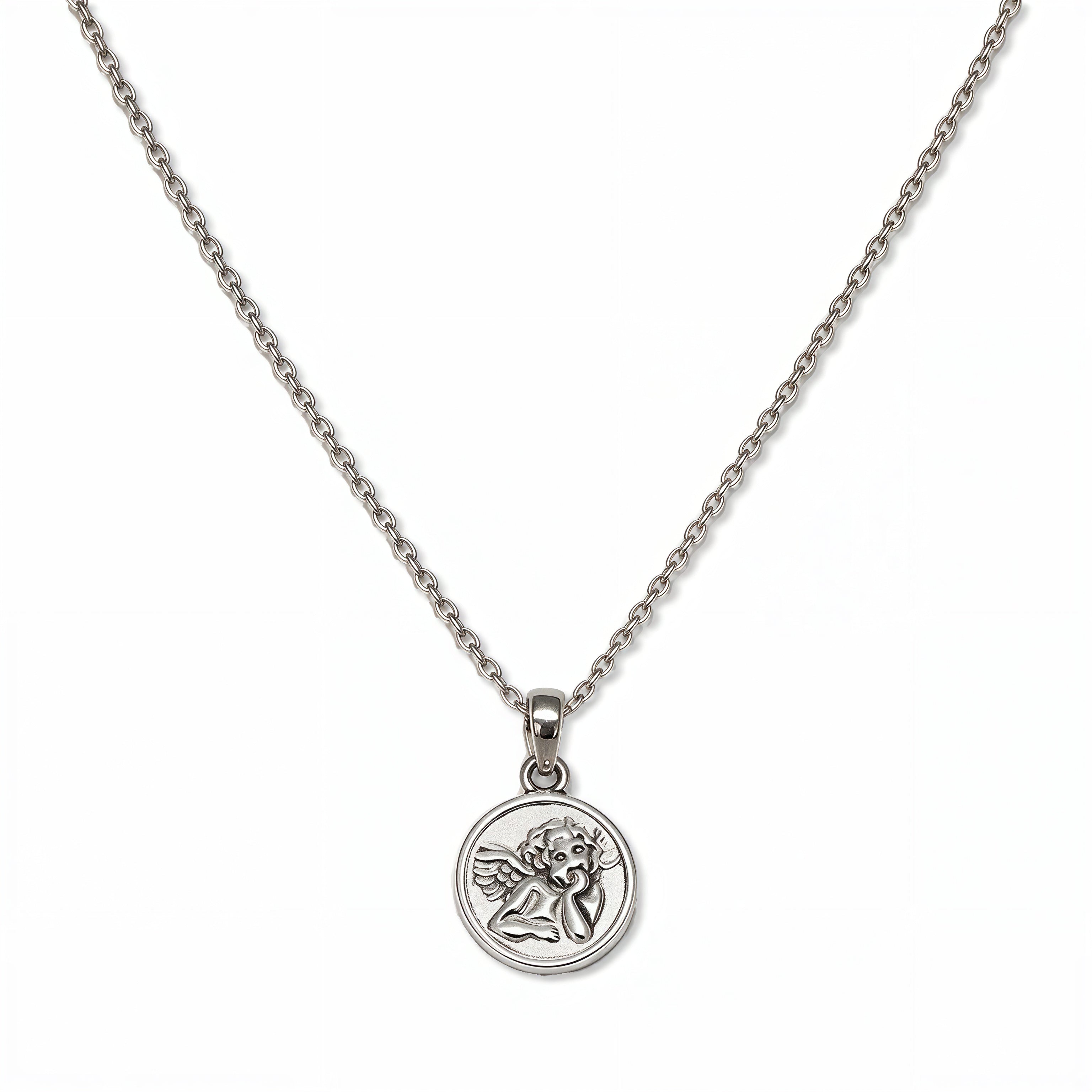 A Skōsh Kids Guardian Angel Pendant Necklace by Skōsh Jewelry, featuring a round medallion pendant engraved with a guardian angel on a fine sterling silver chain, displayed against a white background.