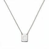 An Engraved Initial Necklace Letter C by Skōsh Jewelry, featuring a small rectangular tag engraved with the letter C on a fine sterling silver chain, displayed against a white background.