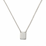 An Engraved Initial Necklace Letter L by Skōsh Jewelry, featuring a small rectangular tag engraved with the letter L on a fine sterling silver chain, displayed against a white background.