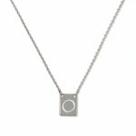 An Engraved Initial Necklace Letter O by Skōsh Jewelry, featuring a small rectangular tag engraved with the letter O on a fine sterling silver chain, displayed against a white background.