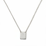 An Engraved Initial Necklace Letter P by Skōsh Jewelry, featuring a small rectangular tag engraved with the letter P on a fine sterling silver chain, displayed against a white background.