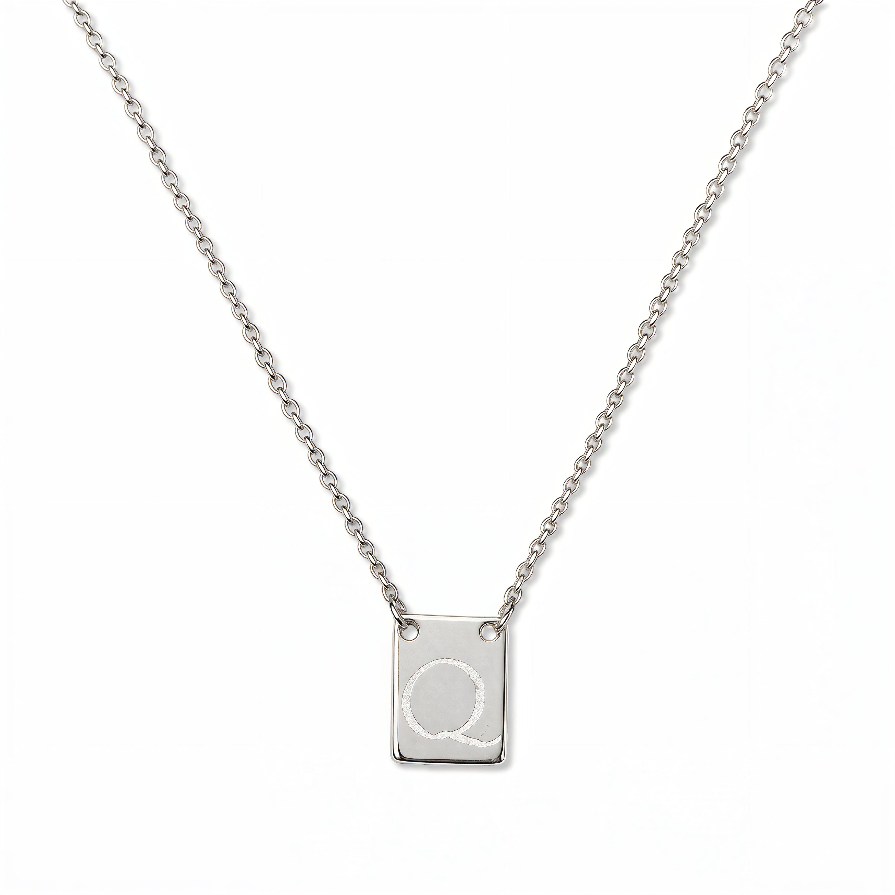 An Engraved Initial Necklace Letter Q by Skōsh Jewelry, featuring a small rectangular tag engraved with the letter Q on a fine sterling silver chain, displayed against a white background.
