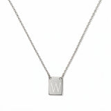 An Engraved Initial Necklace Letter W by Skōsh Jewelry, featuring a small rectangular tag engraved with the letter W on a fine sterling silver chain, displayed against a white background.