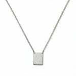 An Engraved Initial Necklace Letter Y by Skōsh Jewelry, featuring a small rectangular tag engraved with the letter Y on a fine sterling silver chain, displayed against a white background.
