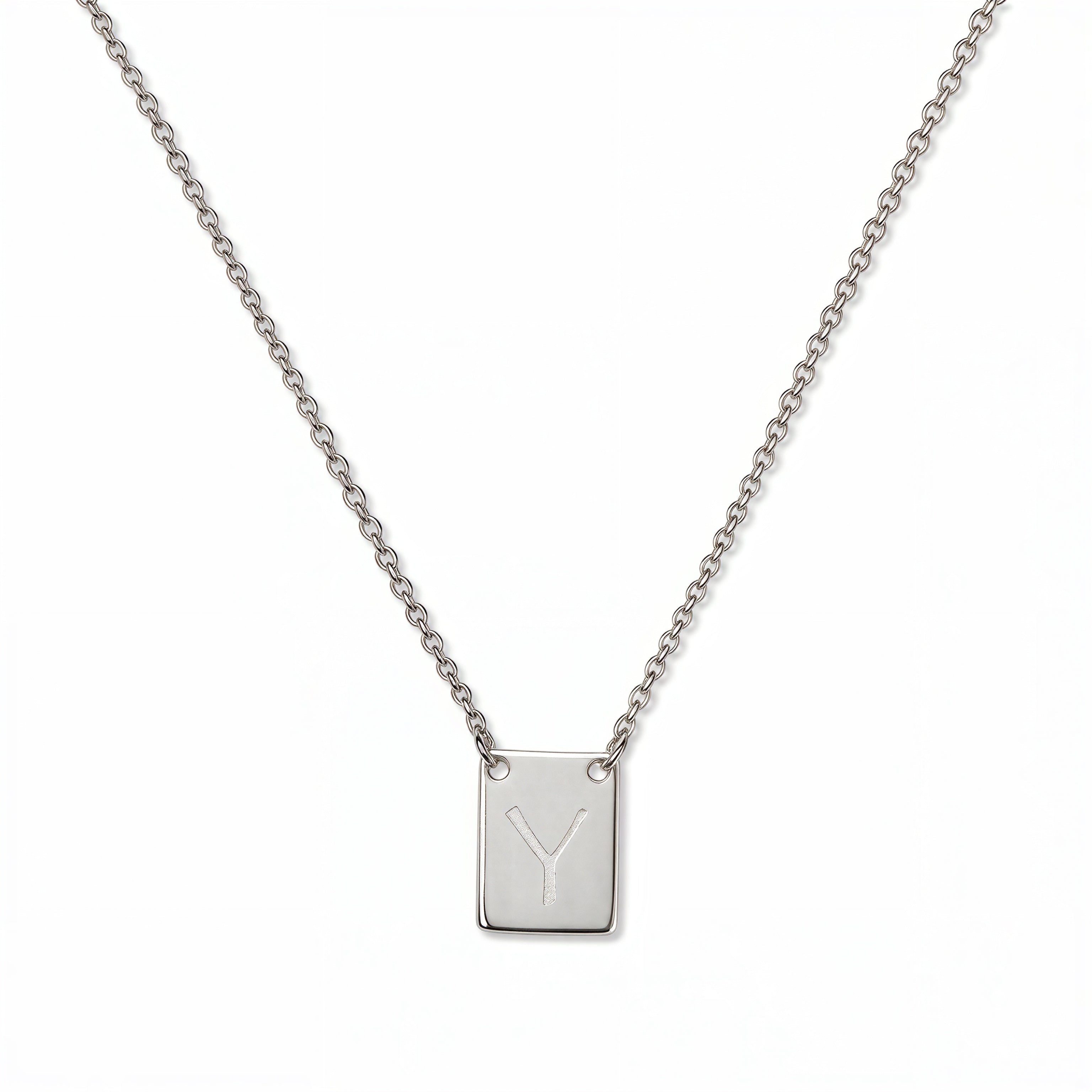 An Engraved Initial Necklace Letter Y by Skōsh Jewelry, featuring a small rectangular tag engraved with the letter Y on a fine sterling silver chain, displayed against a white background.