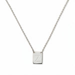 An Engraved Initial Necklace Letter Z by Skōsh Jewelry, featuring a small rectangular tag engraved with the letter Z on a fine sterling silver chain, displayed against a white background.