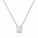 An Engraved Initial Necklace Letter Z by Skōsh Jewelry, featuring a small rectangular tag engraved with the letter Z on a fine sterling silver chain, displayed against a white background.