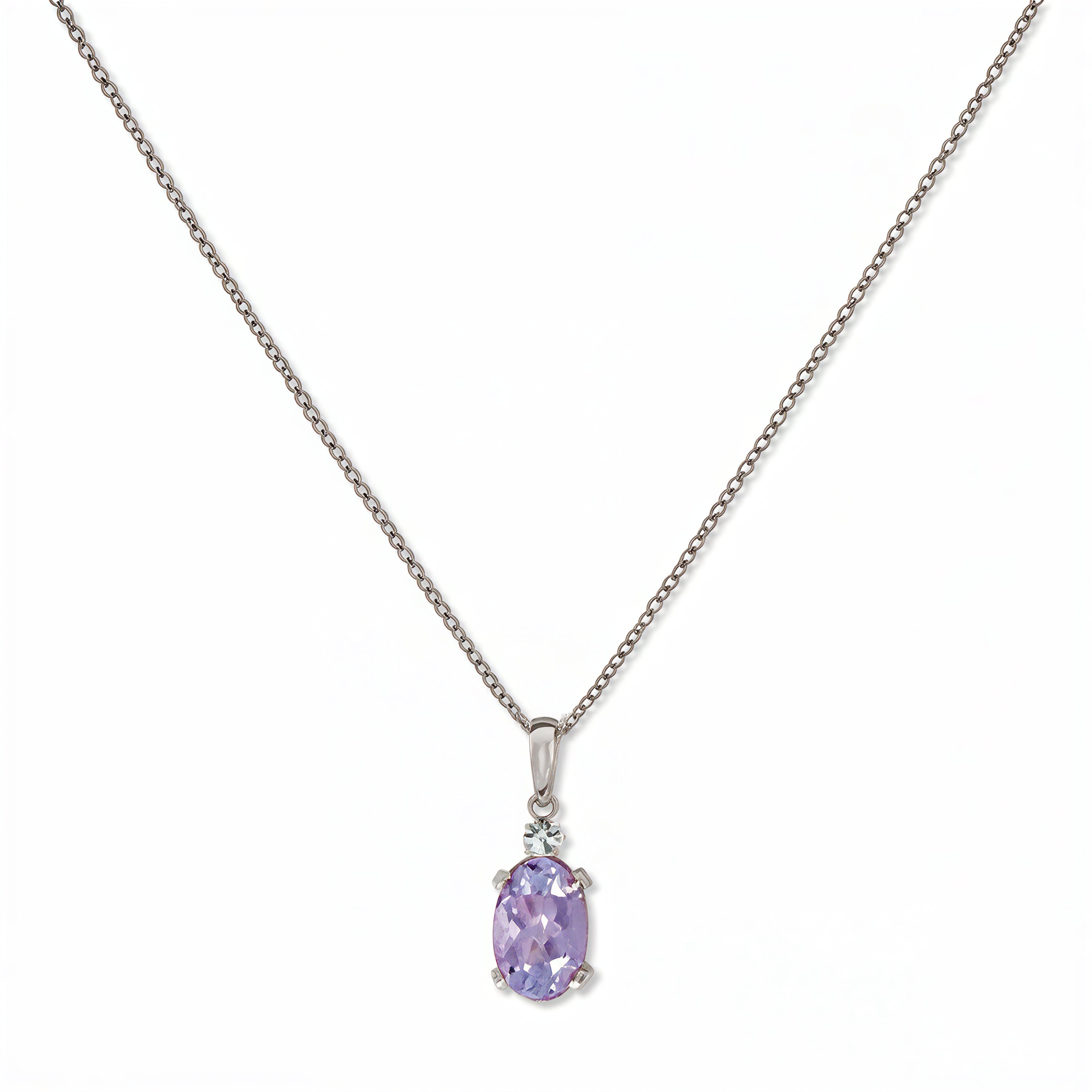 A Skōsh Kids June Birthstone Oval Lavender Cubic Zirconia Necklace by Skōsh Jewelry, featuring an oval faceted light purple stone in a prong setting on a fine sterling silver chain, displayed against a white background.