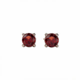 A pair of January Birthstone Round Garnet Cubic Zirconia Stud Earrings by Skōsh Jewelry, featuring faceted deep red round stones in a four-prong sterling silver setting, displayed against a white background.