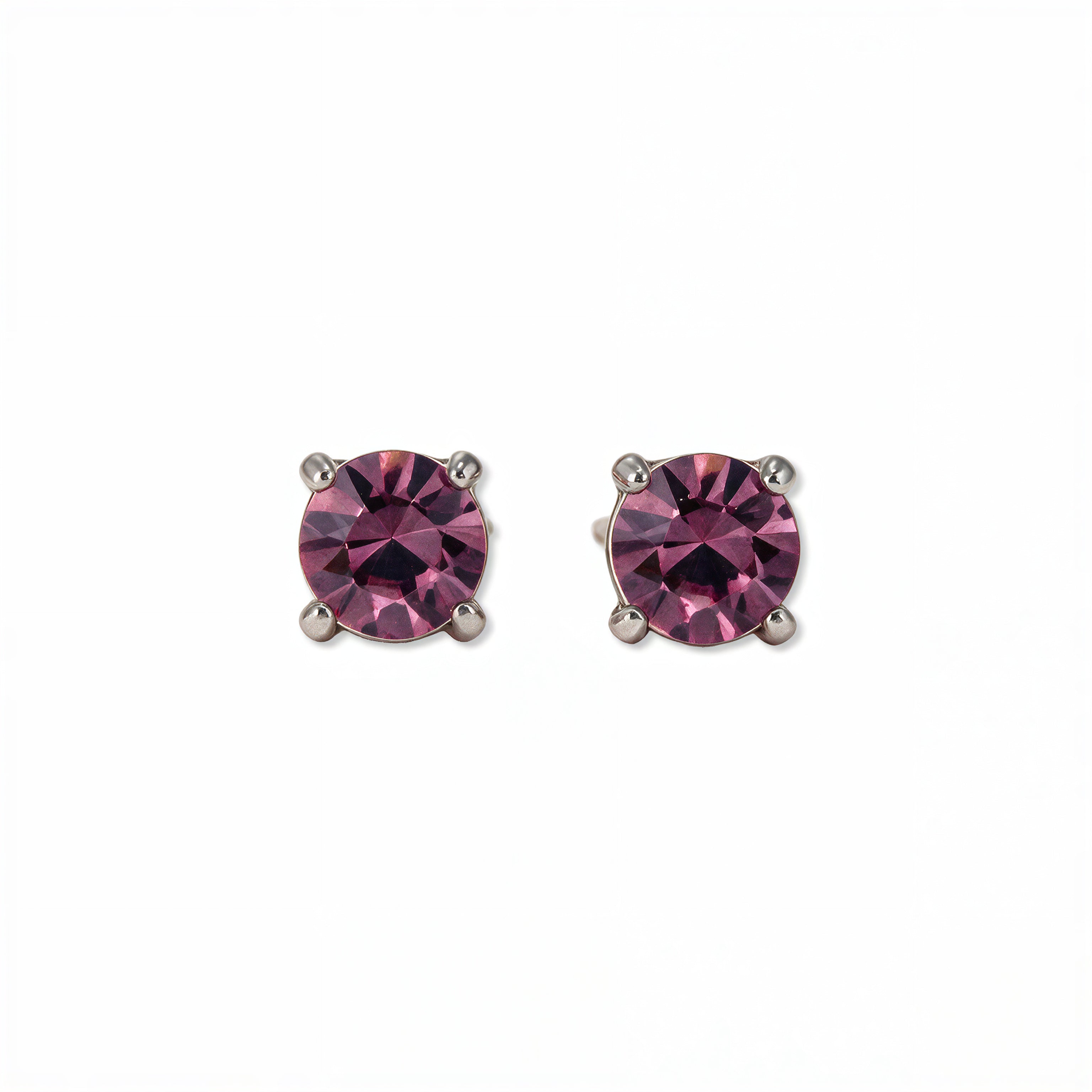 A pair of February Birthstone Round Amethyst Cubic Zirconia Stud Earrings by Skōsh Jewelry, featuring faceted purple round stones in a four-prong sterling silver setting, displayed against a white background.
