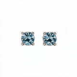 A pair of March Birthstone Round Light Sapphire Cubic Zirconia Stud Earrings by Skōsh Jewelry, featuring faceted light blue round stones in a four-prong sterling silver setting, displayed against a white background.