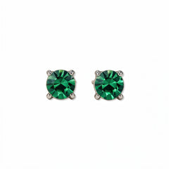 A pair of May Birthstone Round Emerald Cubic Zirconia Stud Earrings by Skōsh Jewelry, featuring faceted green round stones in a four-prong sterling silver setting, displayed against a white background.