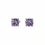 A pair of June Birthstone Round Lavender Cubic Zirconia Stud Earrings by Skōsh Jewelry, featuring faceted light purple round stones in a four-prong sterling silver setting, displayed against a white background.