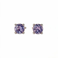 A pair of June Birthstone Round Lavender Cubic Zirconia Stud Earrings by Skōsh Jewelry, featuring faceted light purple round stones in a four-prong sterling silver setting, displayed against a white background.