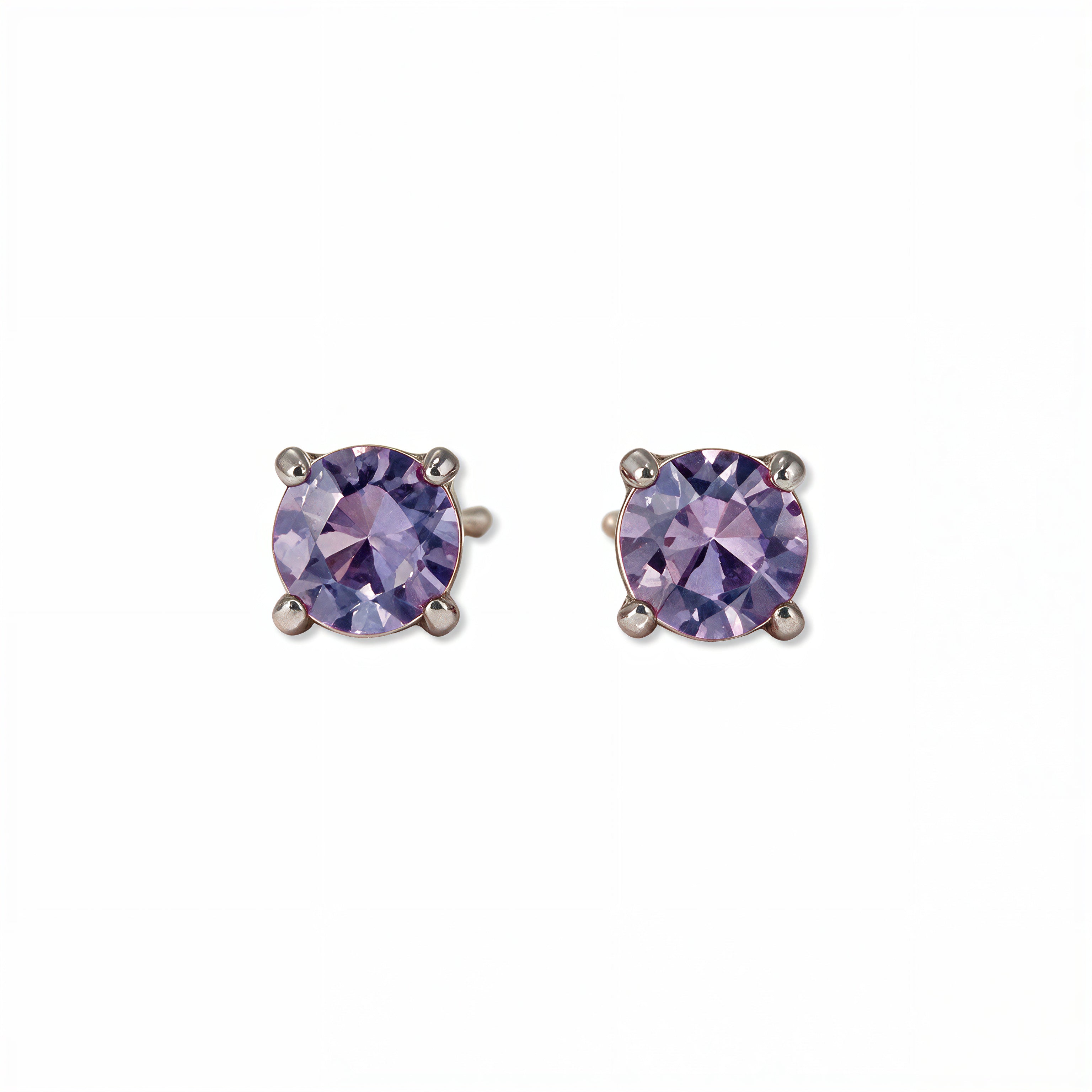 A pair of June Birthstone Round Lavender Cubic Zirconia Stud Earrings by Skōsh Jewelry, featuring faceted light purple round stones in a four-prong sterling silver setting, displayed against a white background.