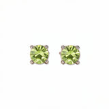 A pair of August Birthstone Round Peridot Cubic Zirconia Stud Earrings by Skōsh Jewelry, featuring faceted light green round stones in a four-prong sterling silver setting, displayed against a white background.