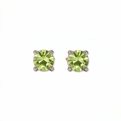 A pair of August Birthstone Round Peridot Cubic Zirconia Stud Earrings by Skōsh Jewelry, featuring faceted light green round stones in a four-prong sterling silver setting, displayed against a white background.