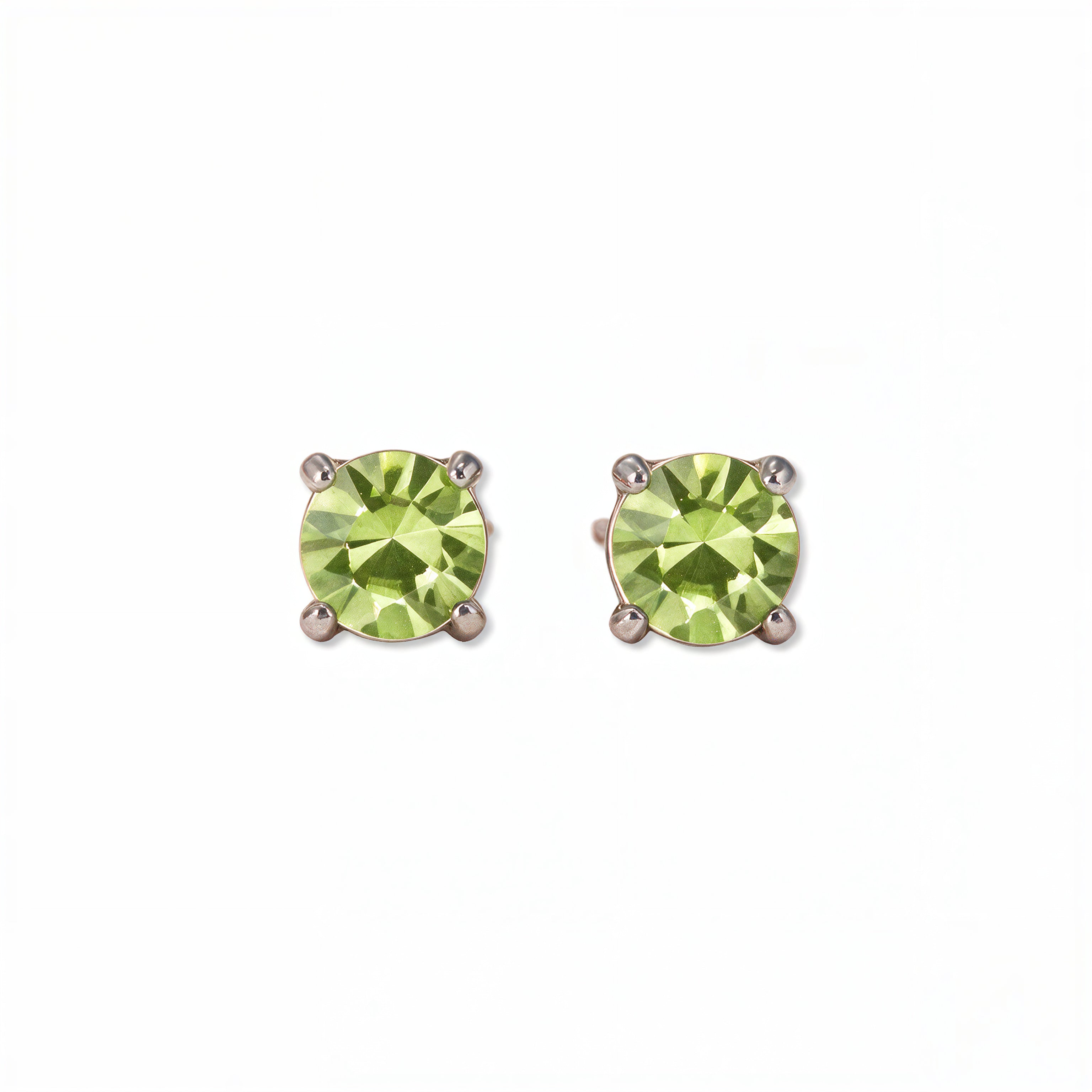 A pair of August Birthstone Round Peridot Cubic Zirconia Stud Earrings by Skōsh Jewelry, featuring faceted light green round stones in a four-prong sterling silver setting, displayed against a white background.