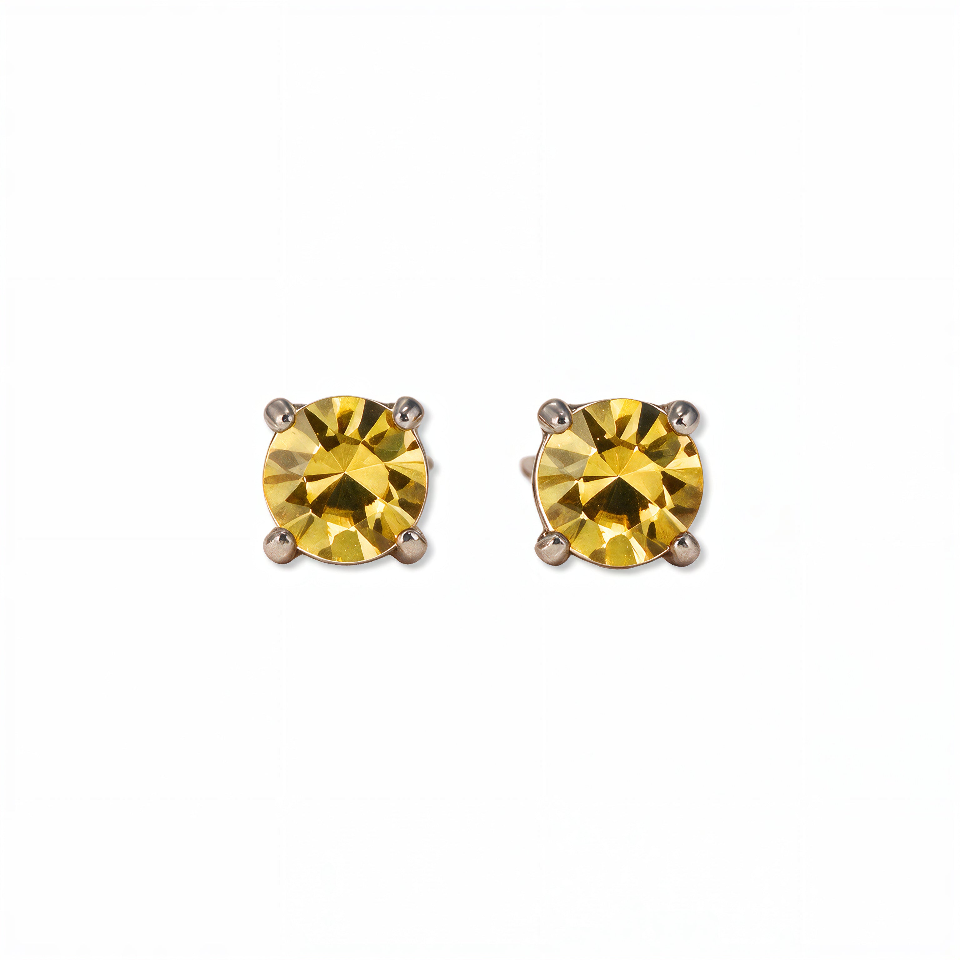 A pair of November Birthstone Round Citrine Cubic Zirconia Stud Earrings by Skōsh Jewelry, featuring faceted yellow round stones in a four-prong sterling silver setting, displayed against a white background.