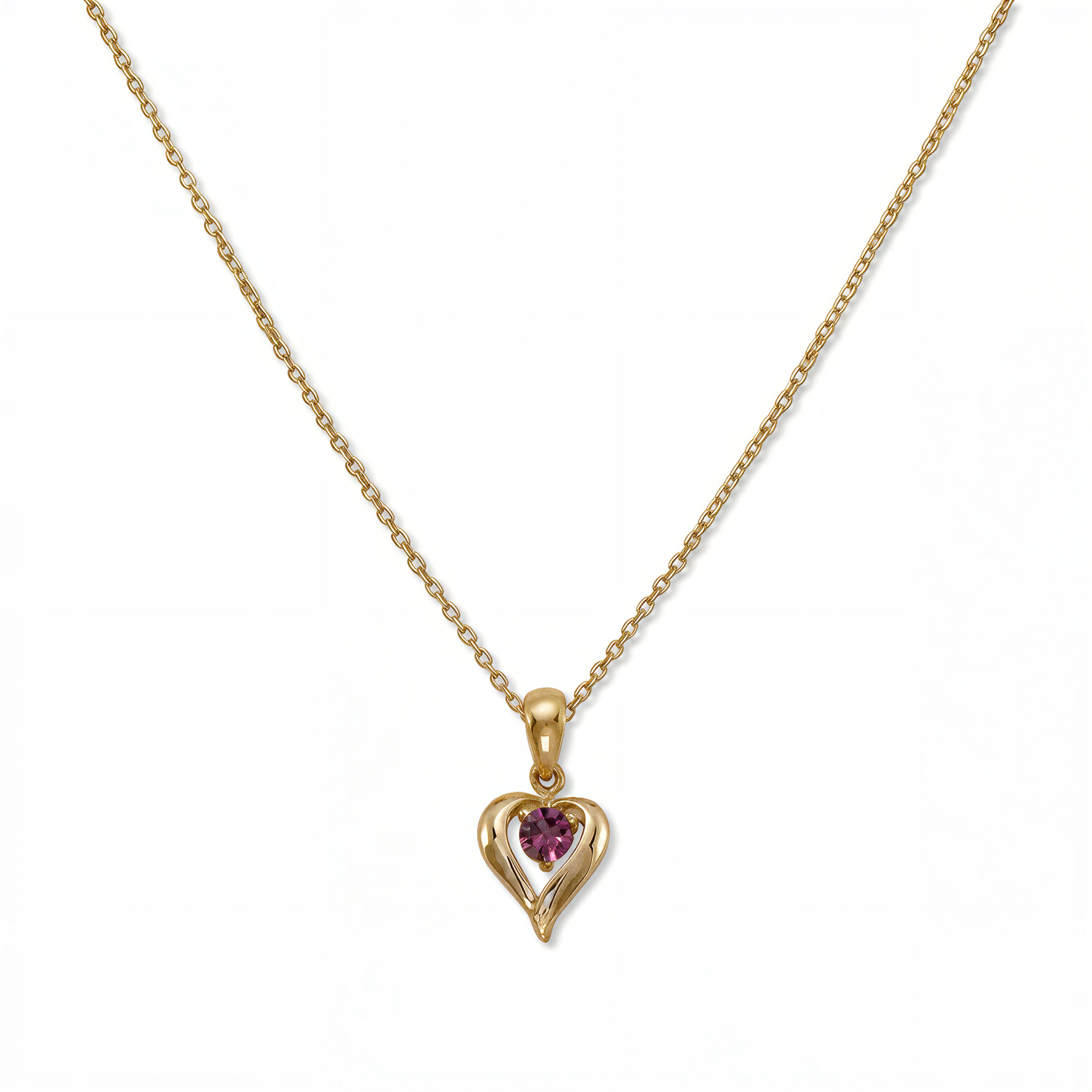 A February Birthstone Amethyst Cubic Zirconia Heart Necklace by Skōsh Jewelry, featuring a heart-shaped purple stone framed in a sculpted gold heart pendant on a fine chain, displayed against a white background.