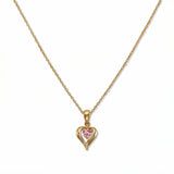 An October Birthstone Pink Cubic Zirconia Heart Necklace by Skōsh Jewelry, featuring a heart-shaped pink stone framed in a sculpted gold heart pendant on a fine chain, displayed against a white background.