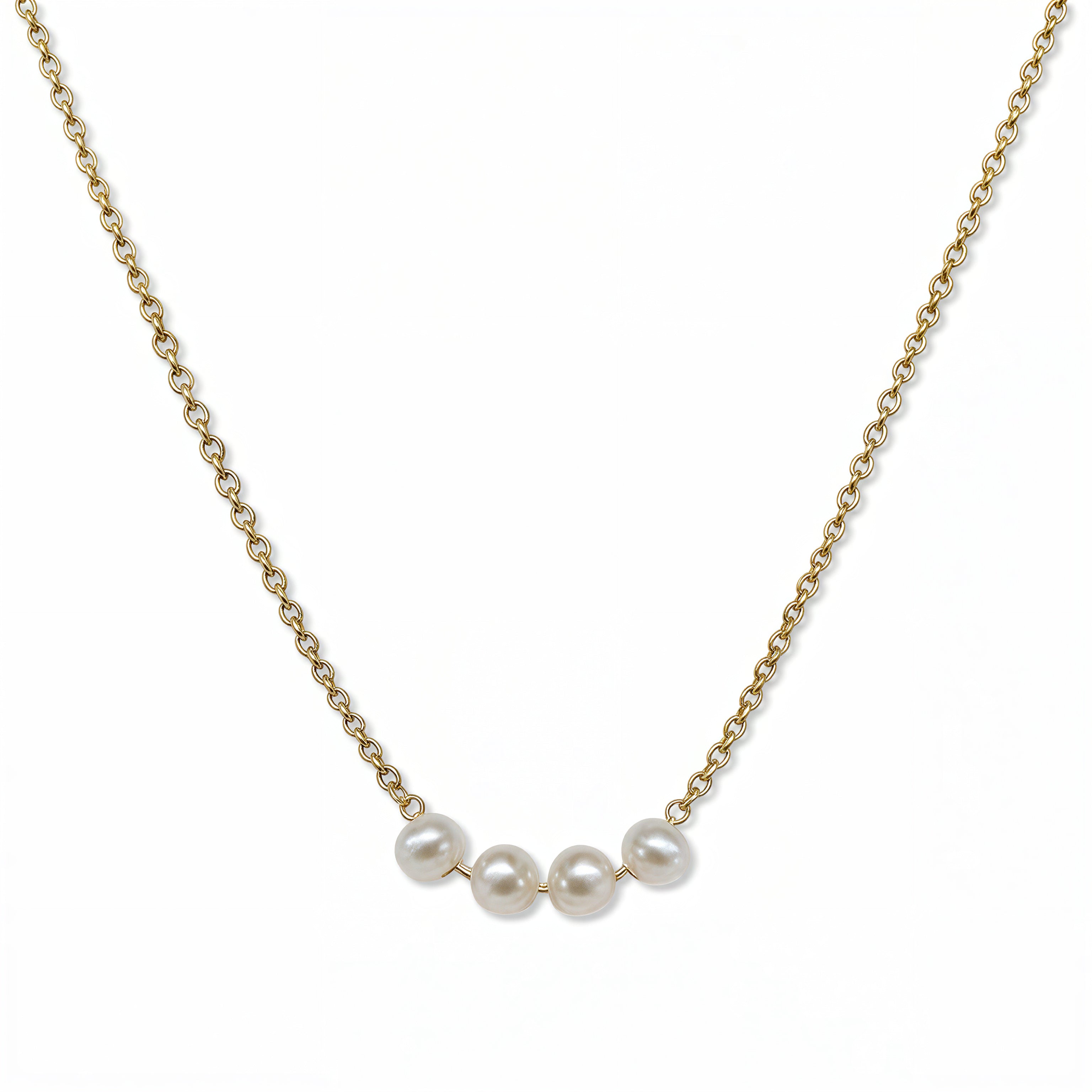 A Skōsh Kids "I'm Four" Petite Freshwater Pearl Necklace by Skōsh Jewelry, featuring four small white freshwater pearls along a fine gold chain, displayed against a white background.