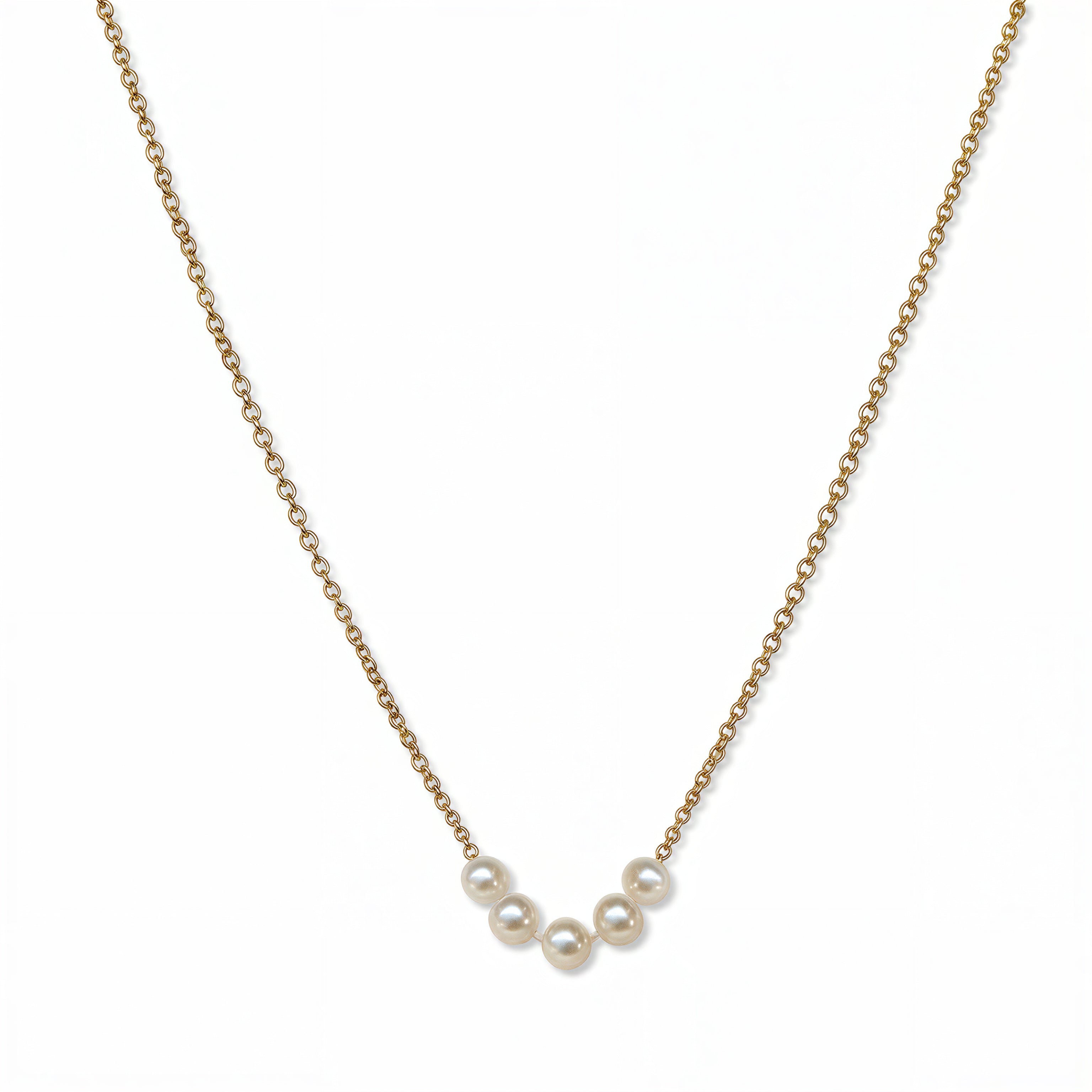 A Skōsh Kids "I'm Five" Petite Freshwater Pearl Necklace by Skōsh Jewelry, featuring five small white freshwater pearls along a fine gold chain, displayed against a white background.