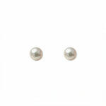 A pair of Freshwater Cultured Pearl 4mm Stud Earrings by Skōsh Jewelry, featuring round, lustrous white freshwater pearls on sterling silver post backs, displayed against a white background.