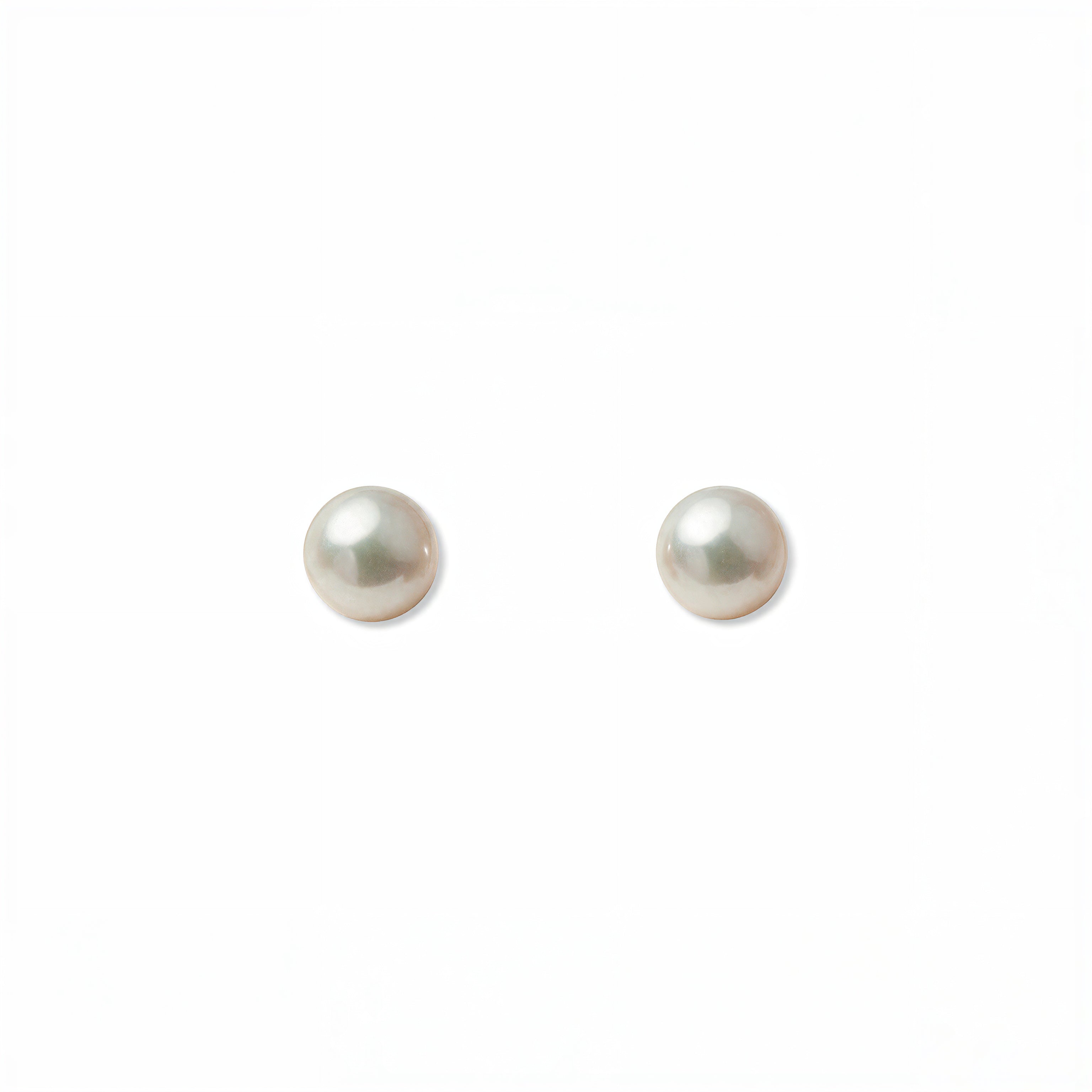 A pair of Freshwater Cultured Pearl 4mm Stud Earrings by Skōsh Jewelry, featuring round, lustrous white freshwater pearls on sterling silver post backs, displayed against a white background.