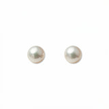 A pair of Freshwater Cultured Pearl 6mm Stud Earrings by Skōsh Jewelry, featuring round, lustrous white freshwater pearls on sterling silver post backs, displayed against a white background.
