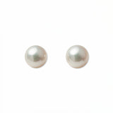 A pair of Freshwater Cultured Pearl 8mm Stud Earrings by Skōsh Jewelry, featuring round, lustrous white freshwater pearls on sterling silver post backs, displayed against a white background.