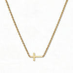 A True Path Inline Sideways Cross Necklace by Skōsh Jewelry, featuring a slim polished cross set sideways on a fine gold chain, displayed against a white background.