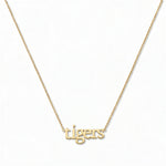 A tigers Gameday Necklace by Skōsh Jewelry, featuring the word 'tigers' in lowercase letters set horizontally on a fine gold chain, displayed against a white background.