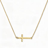 An Abide Sideways Cross Necklace by Skōsh Jewelry, featuring a classic polished cross set sideways on a fine gold chain, displayed against a white background.