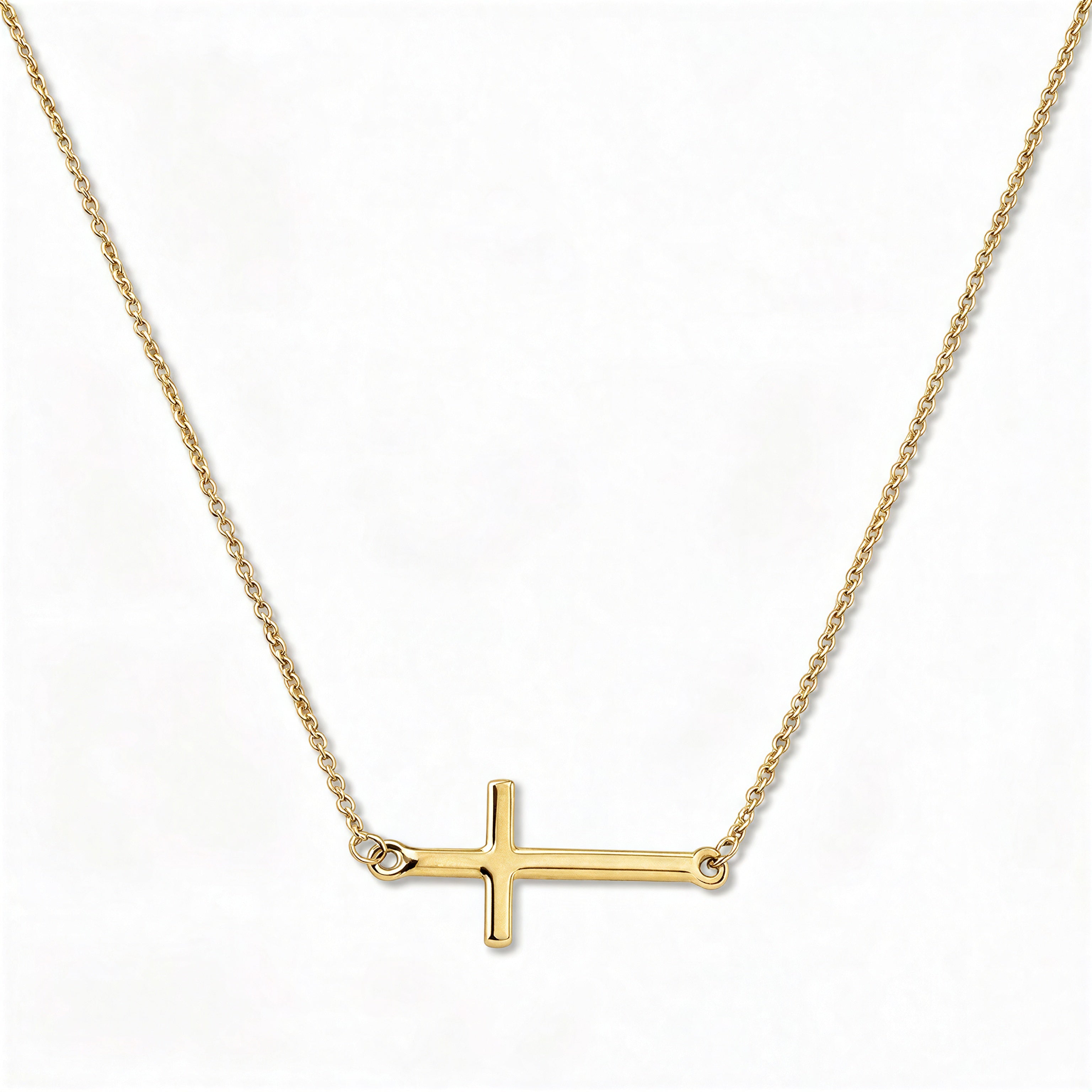 An Abide Sideways Cross Necklace by Skōsh Jewelry, featuring a classic polished cross set sideways on a fine gold chain, displayed against a white background.