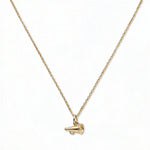 A Megaphone Gameday Necklace by Skōsh Jewelry, featuring a small cheerleader megaphone pendant on a fine gold chain, displayed against a white background.