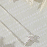 Devoted White Cubic Zirconia Sideways Cross Necklace in sterling silver by Skōsh Jewelry