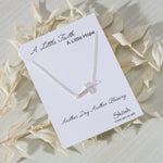 Devoted White Cubic Zirconia Sideways Cross Necklace in sterling silver by Skōsh Jewelry