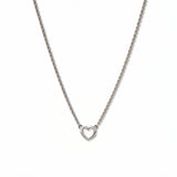 A Lucent Mini Heart Necklace by Skōsh Jewelry, featuring a tiny open heart set on a fine sterling silver chain, displayed against a white background.